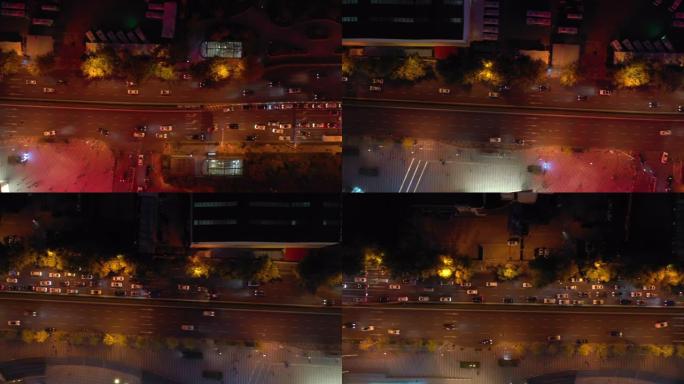 夜间照明青岛市市中心交通街道十字路口空中俯拍全景4k中国