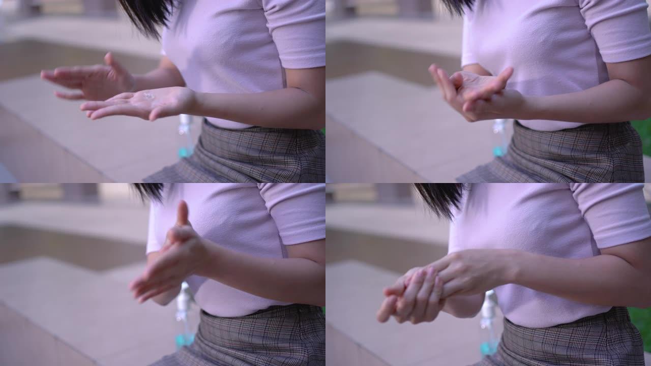4k迷人的亚洲女性使用酒精消毒剂凝胶，然后揉搓手以清除细菌和细菌，病毒covid19，洗手，洗手液，