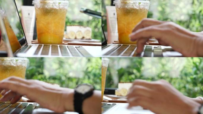 女人在带笔记本电脑的咖啡店工作，使用智能手机并喝饮料