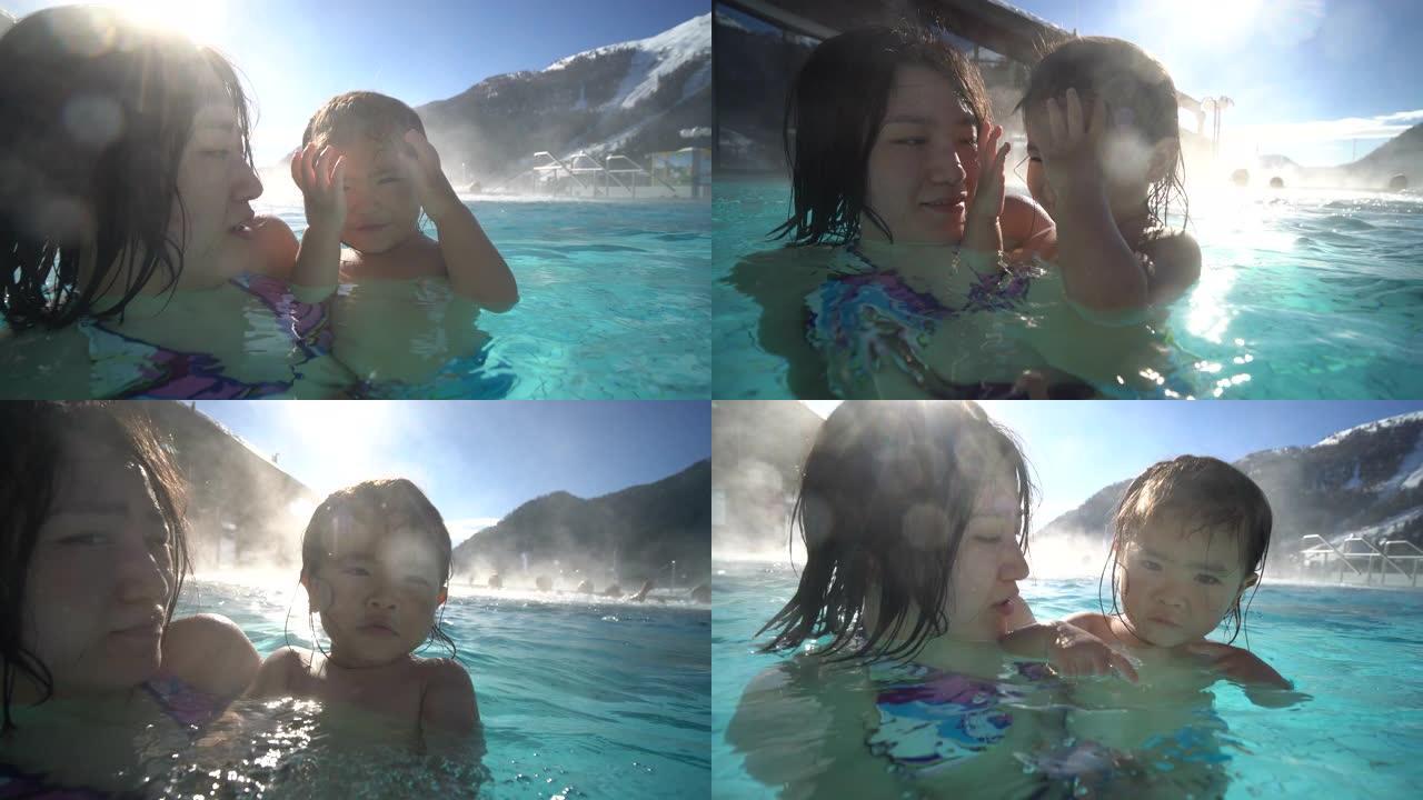 母亲和女婴在瑞士享受温泉