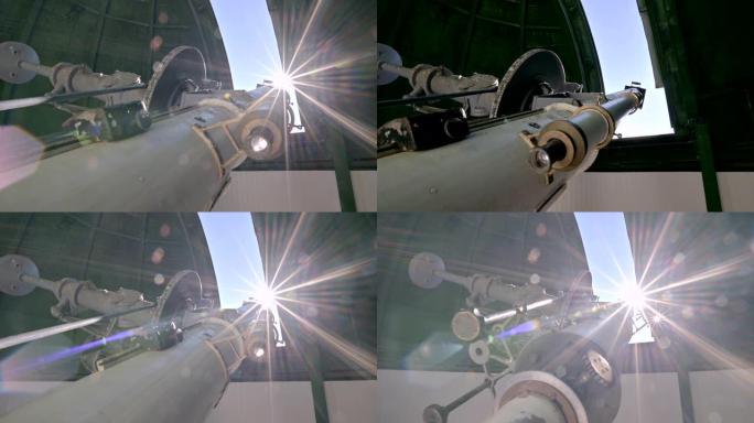 在阳光明媚的日子里，太阳天文台的圆顶下有一个古老的工作太阳日冕仪的特写视图