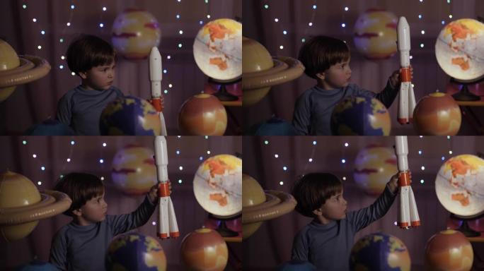 太空旅行游戏灵感飞船。小男孩宇航员从太空港通过行星发射玩具火箭。儿童梦想家玩玩具太空火箭在行星间飞行