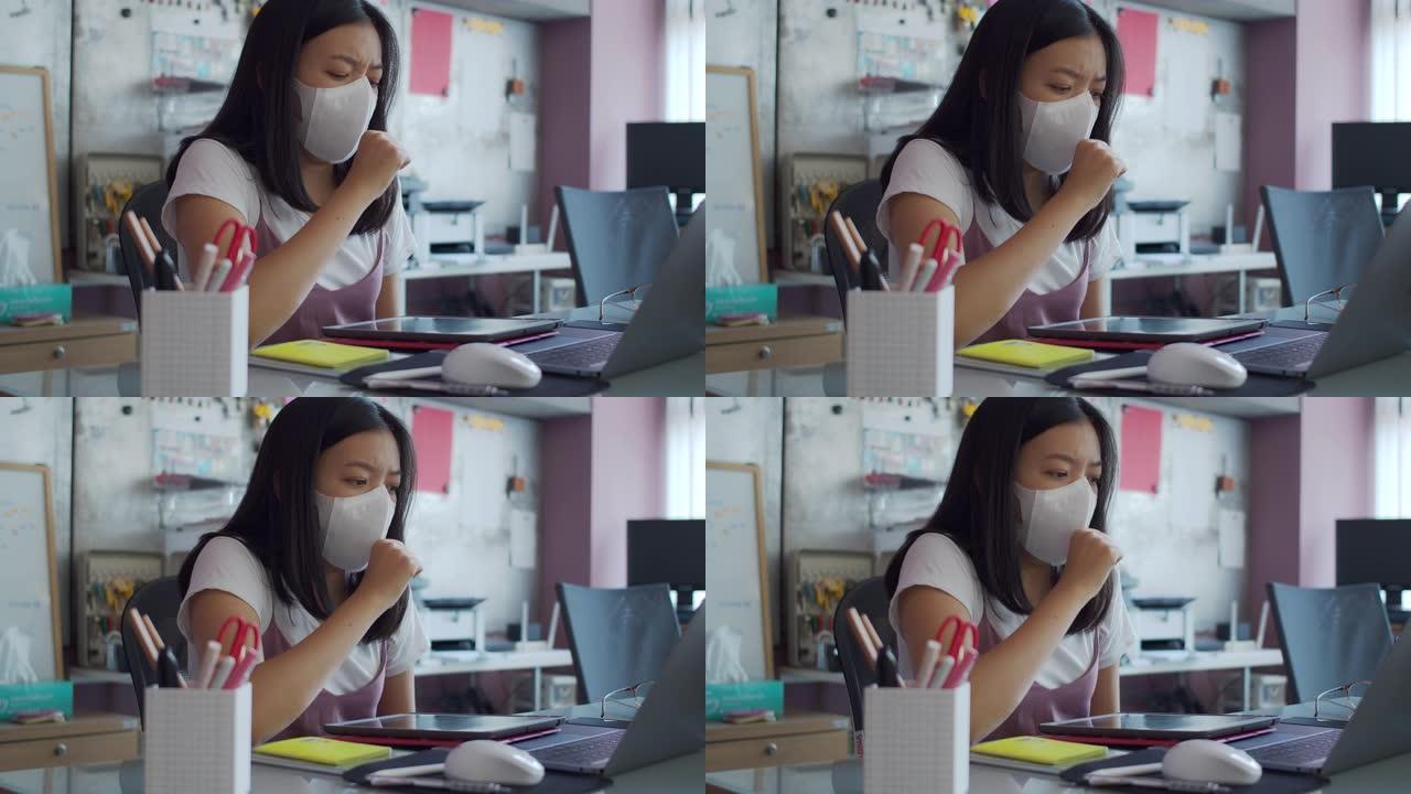 亚洲女商人戴着口罩患有流感，在家庭办公室背景下咳嗽。戴上口罩以防止病毒与他人连接的传播。4k UHD