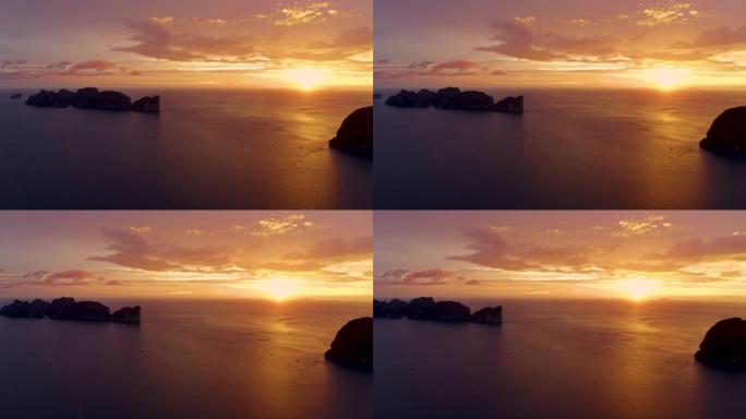 泰国甲米府披披群岛全景图/泰语。壮观的彩色日落在大海和岛屿上。热带和平静的印度洋的惊人黄昏