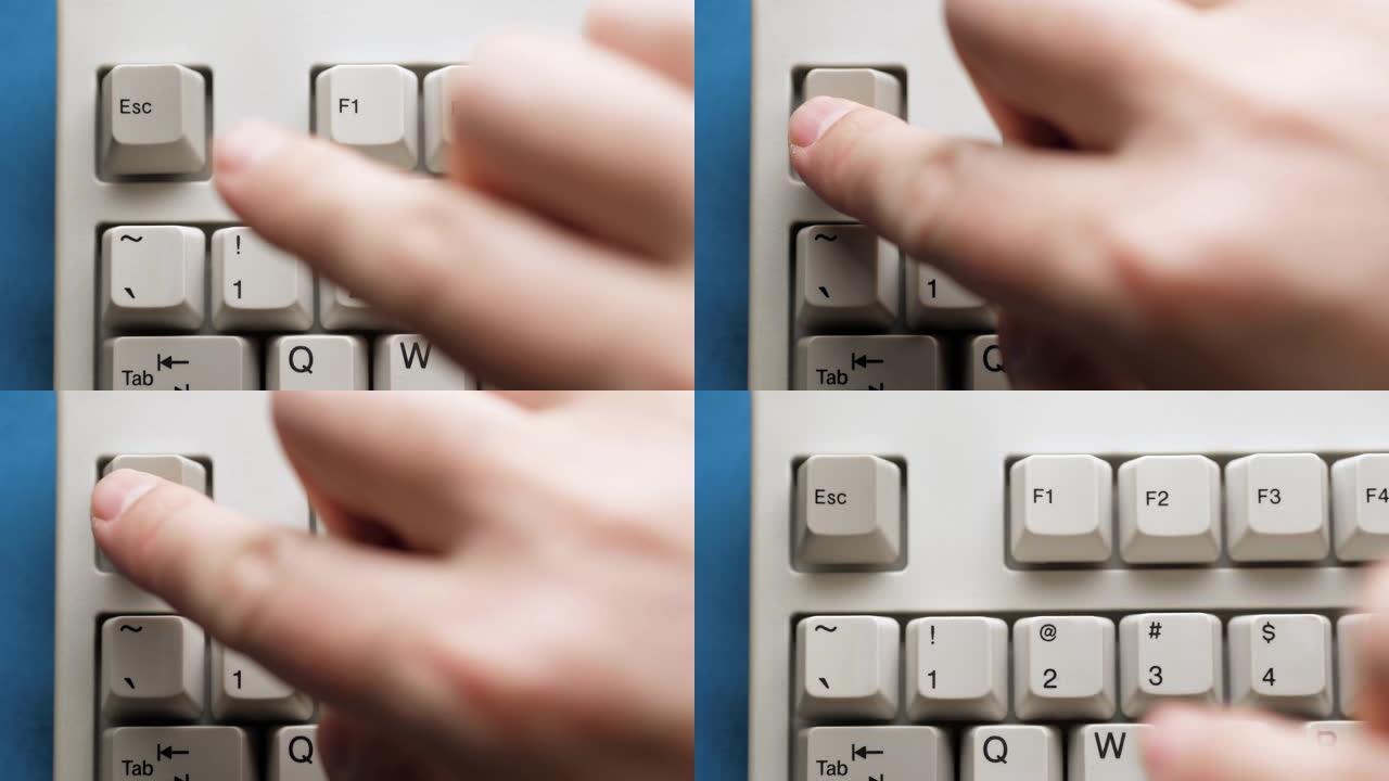 男性手指按下白色键盘上的ESC按钮。慢动作和宏观视图