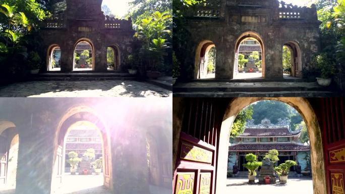 摄像机穿过巨大的石门移动到寺庙内院子