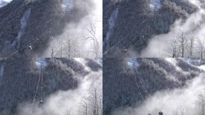 滑雪电梯在低地雪山森林上空移动。无人机景观滑雪缆车将滑雪者和滑雪板运送到冬季自然景观上的避暑山庄的雪