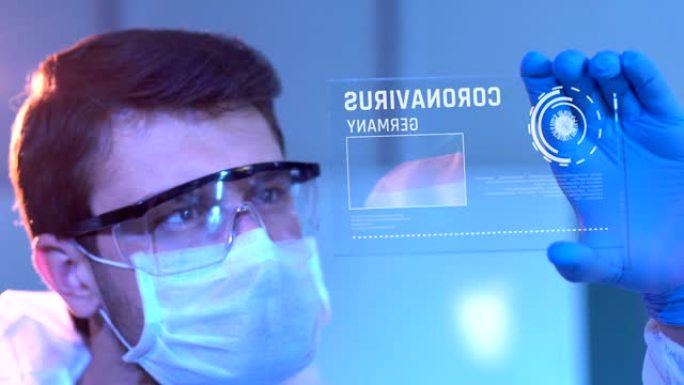 研究人员在实验室的数字屏幕上查看德国的冠状病毒结果