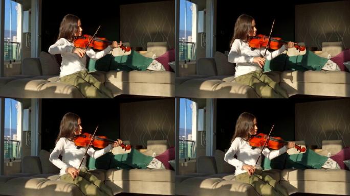 小可爱女孩在家里拉小提琴