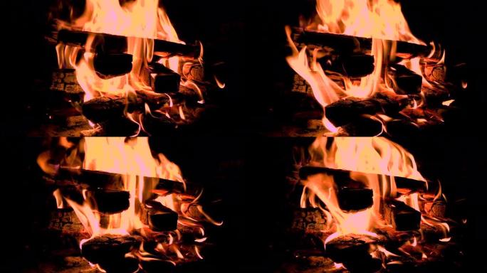 装满木头的热壁炉。燃烧原木产生的真正火焰。壁炉背景。火苗特写。