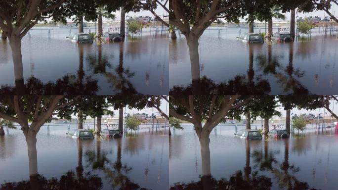 停车场的汽车被淹。深水。大雨过后的洪水自然