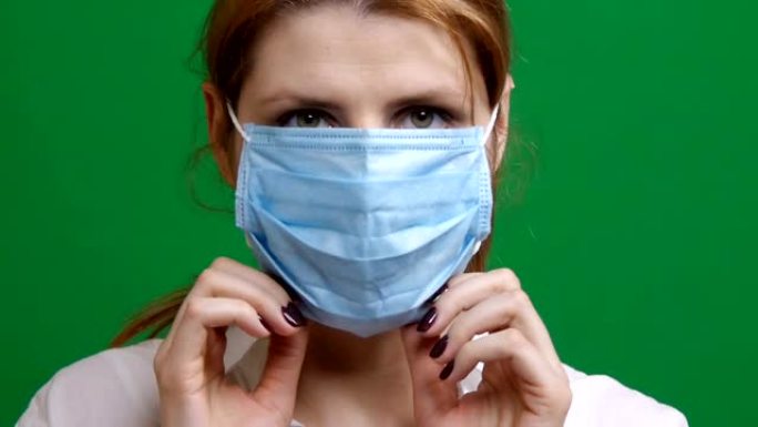 女孩戴上防护医用口罩。在疫情病毒的恐慌中。冠状病毒大流行的COVID危险2019-ncov。Chro