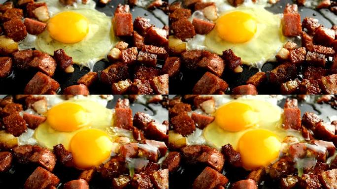 煎蛋或煎蛋卷和切成丁的脆皮香肠和培根在热脂肪中油炸。