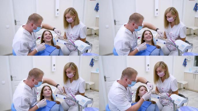 牙医与病人助理一起工作。
