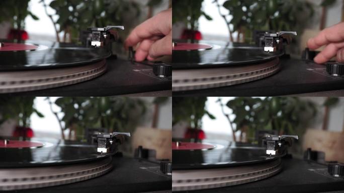 黑胶唱片上的触控针与光盘旋转特写播放。针头落在乙烯基圆盘上。老式乙烯基唱机正在旋转。
