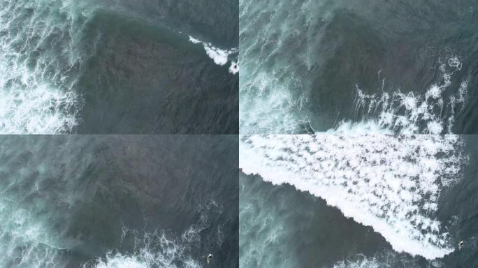 航拍画面，无人机海浪和冲浪者在印度洋冲浪的俯视图，4k