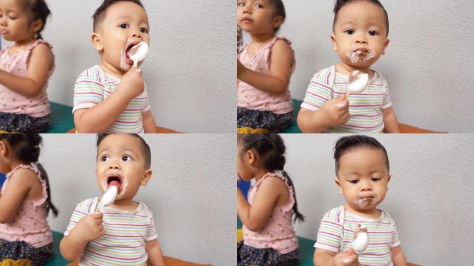 亚洲儿童一起吃冰淇淋，看起来凌乱