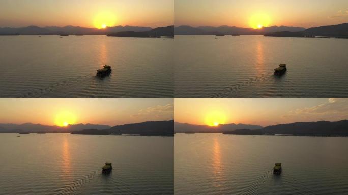 杭州市日落时间飞行在著名的湖泊旅游水上交通空中全景4k中国