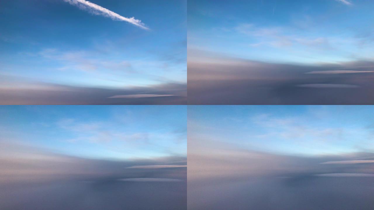 旅行时从窗口飞机看空中天空和云景