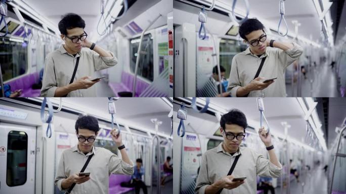 自由职业者尝试使用智能手机并在晚上在地铁上听音乐