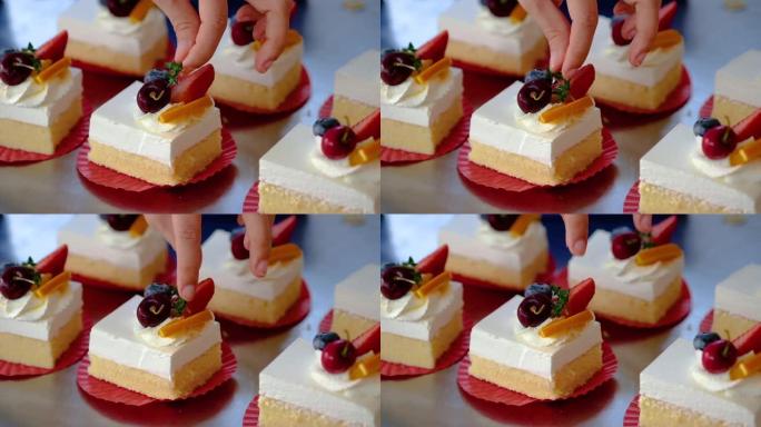 甜点厨师女性将百里香放在蛋糕上。慢动作