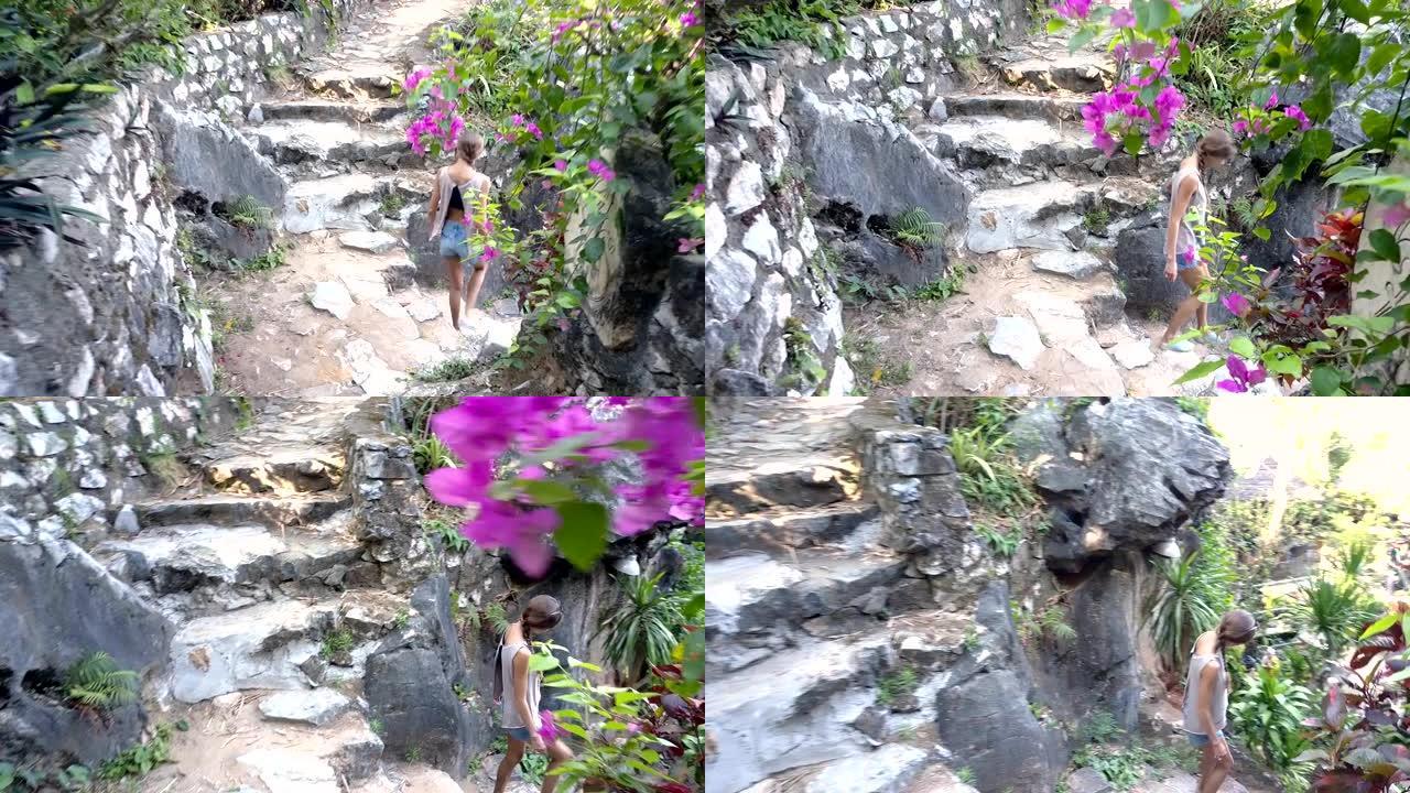 侧视图女孩走下通往院子的石阶