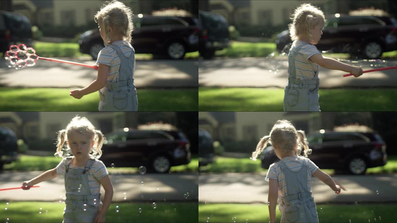 一个小女孩用泡泡棒旋转，在慢动作中产生很多气泡