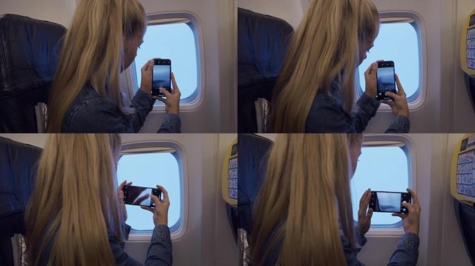 十几岁的女孩从飞机上拍摄风景