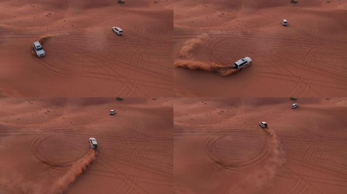 空中。一列白色汽车在沙漠中行驶。