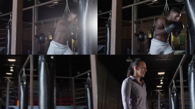 年轻，健康的非裔美国人在MMA健身房击中沉重的包