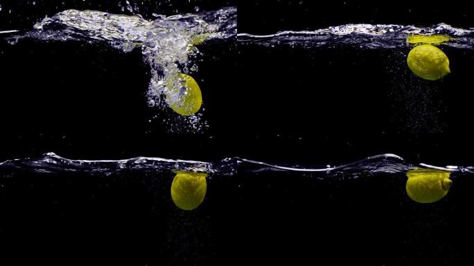 柠檬以慢动作落在水中。孤立在黑色背景上。特写视图。用电影相机拍摄红龙，FHD，240fps