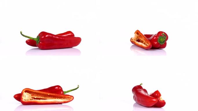 新鲜的红辣椒在白色背景上旋转的无尽循环。侧视图。