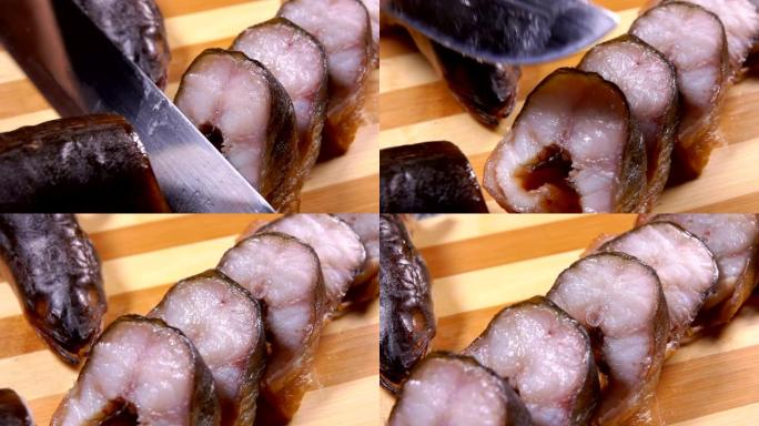 将美味的烟熏鳗鱼切成薄片的刀的特写