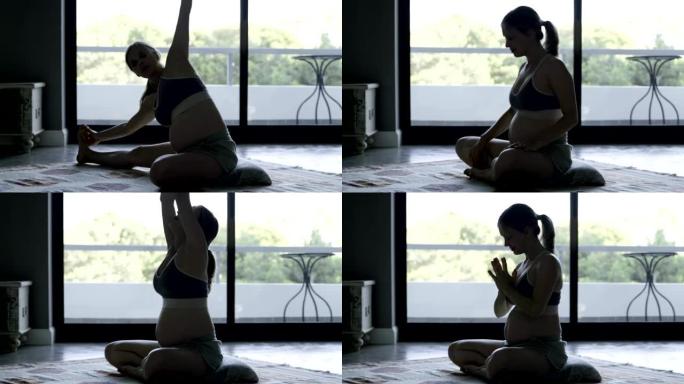 宁静的孕妇在家练习瑜伽