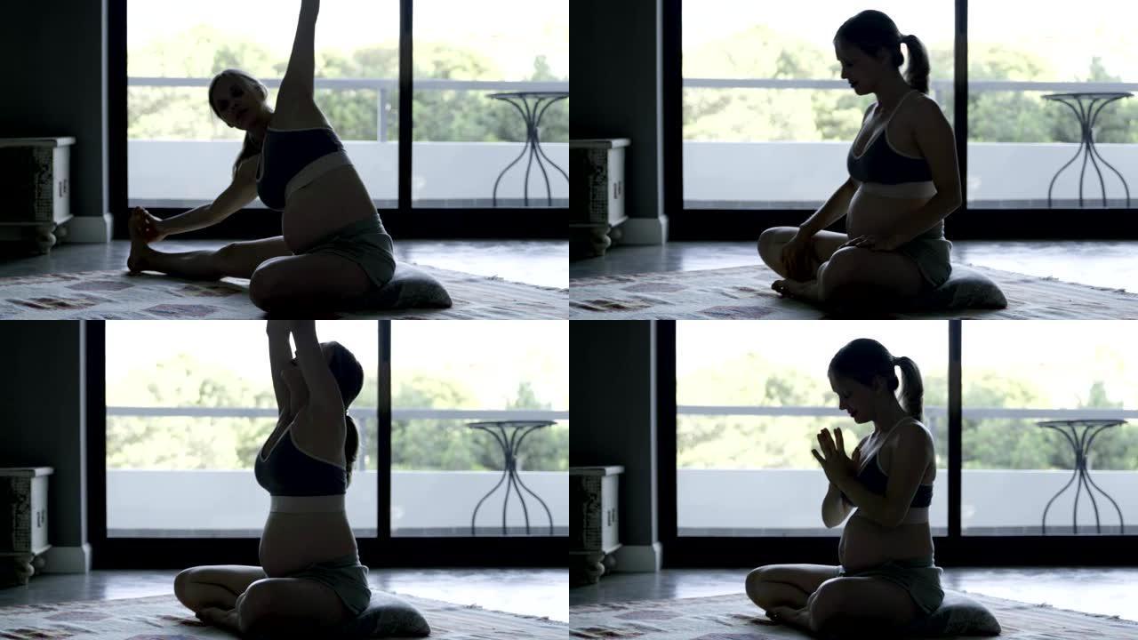 宁静的孕妇在家练习瑜伽