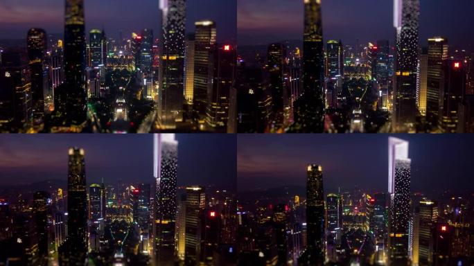 夜间日落时间照明广州市中心城市景观空中倾斜移动全景4k延时中国
