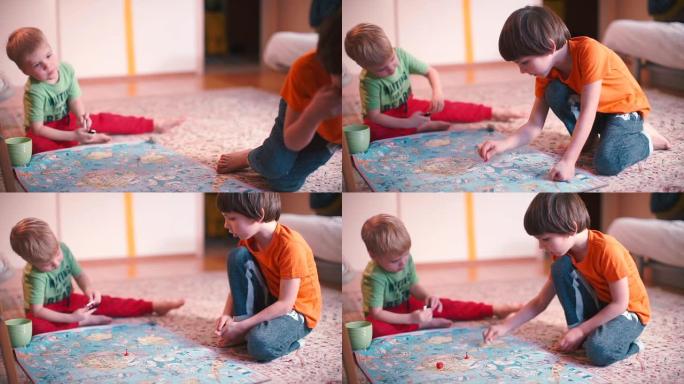 两个孩子在地板上玩游戏