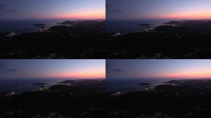 布德瓦里维埃拉夜间海岸线。黑山、巴尔干半岛、亚得里亚海。从山路路径的顶部观看。