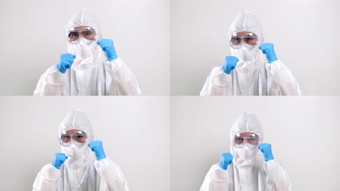 医务人员肖像，自信的亚洲医生穿着防护服戴着口罩和眼镜准备与病毒战斗
