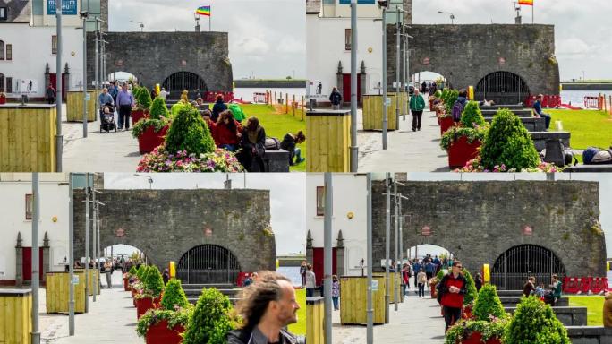 在爱尔兰戈尔韦市，人们在西班牙拱门周围熙熙攘攘