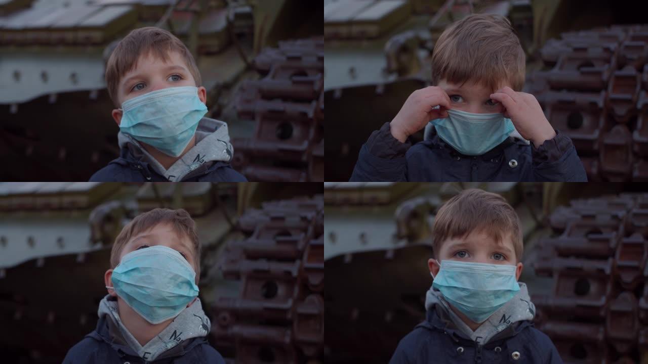 在冠状病毒新型冠状病毒肺炎大流行期间，戴着医用防护面具的男孩站在军用机器旁，四处观察。检疫紧急和戒严