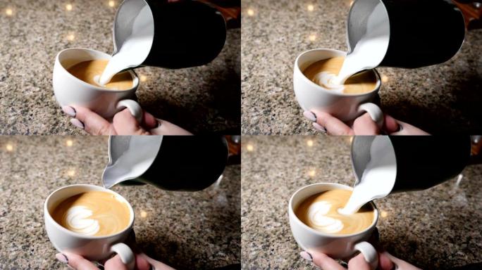 煮咖啡。咖啡师准备咖啡。拿铁的制备。咖啡师将热牛奶倒入一杯浓缩咖啡中。拿铁艺术。慢动作