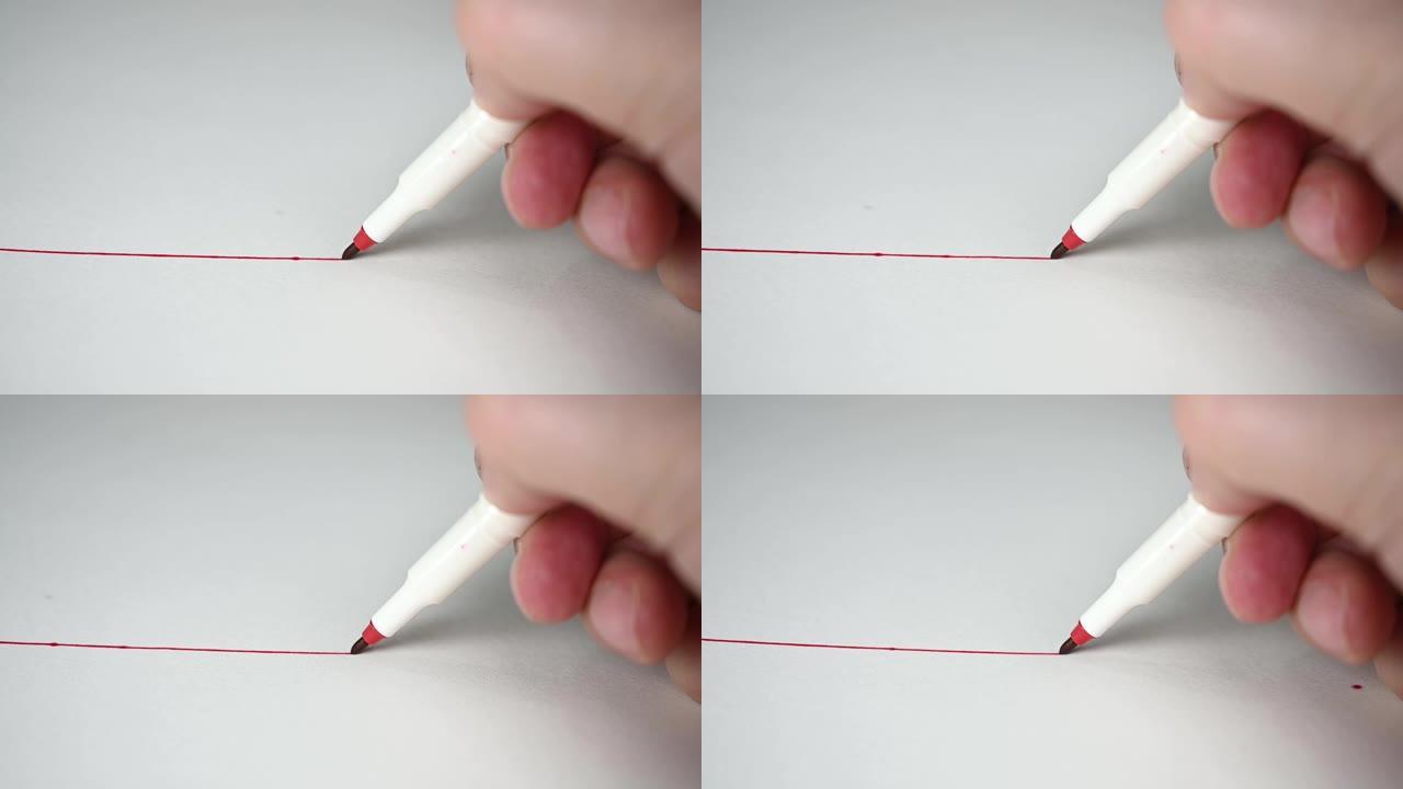 慢动作。用红色铅笔在白色画纸上画红线。教育理念。