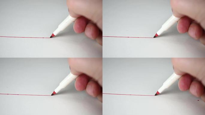 慢动作。用红色铅笔在白色画纸上画红线。教育理念。
