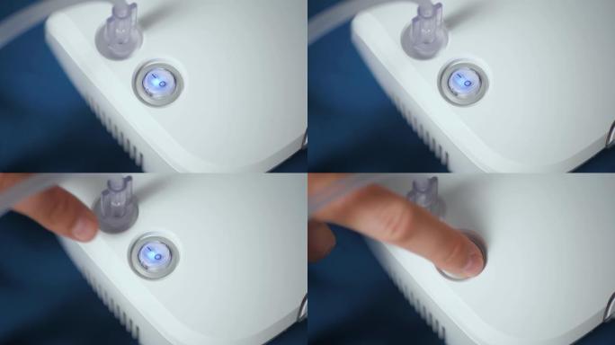 男性手指按下喷雾器上的关闭按钮进行吸入。按钮关闭蓝色。慢动作和特写