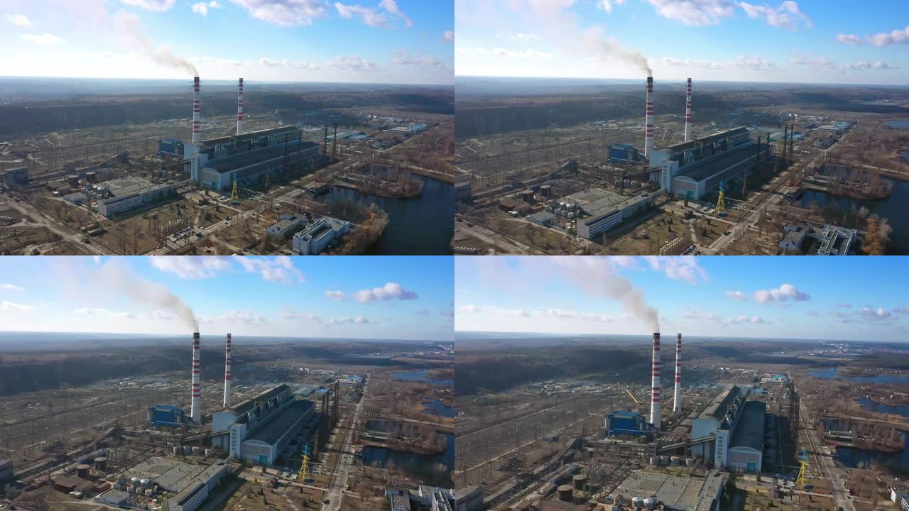 燃煤电厂灰烟高的烟囱管道的鸟瞰图。用化石燃料生产电力。