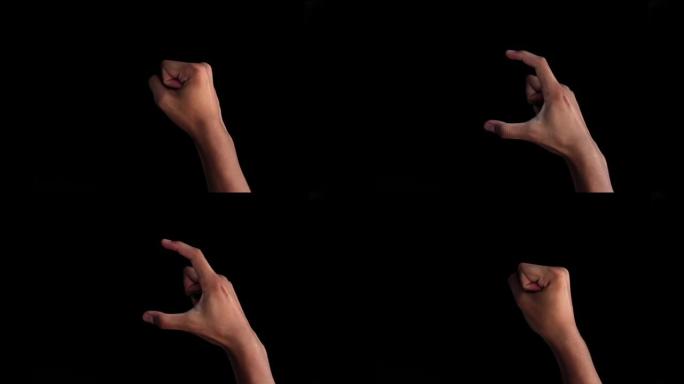 一对男性的双手走上前来，展示英国手语中用于聋哑人的C字母手势。