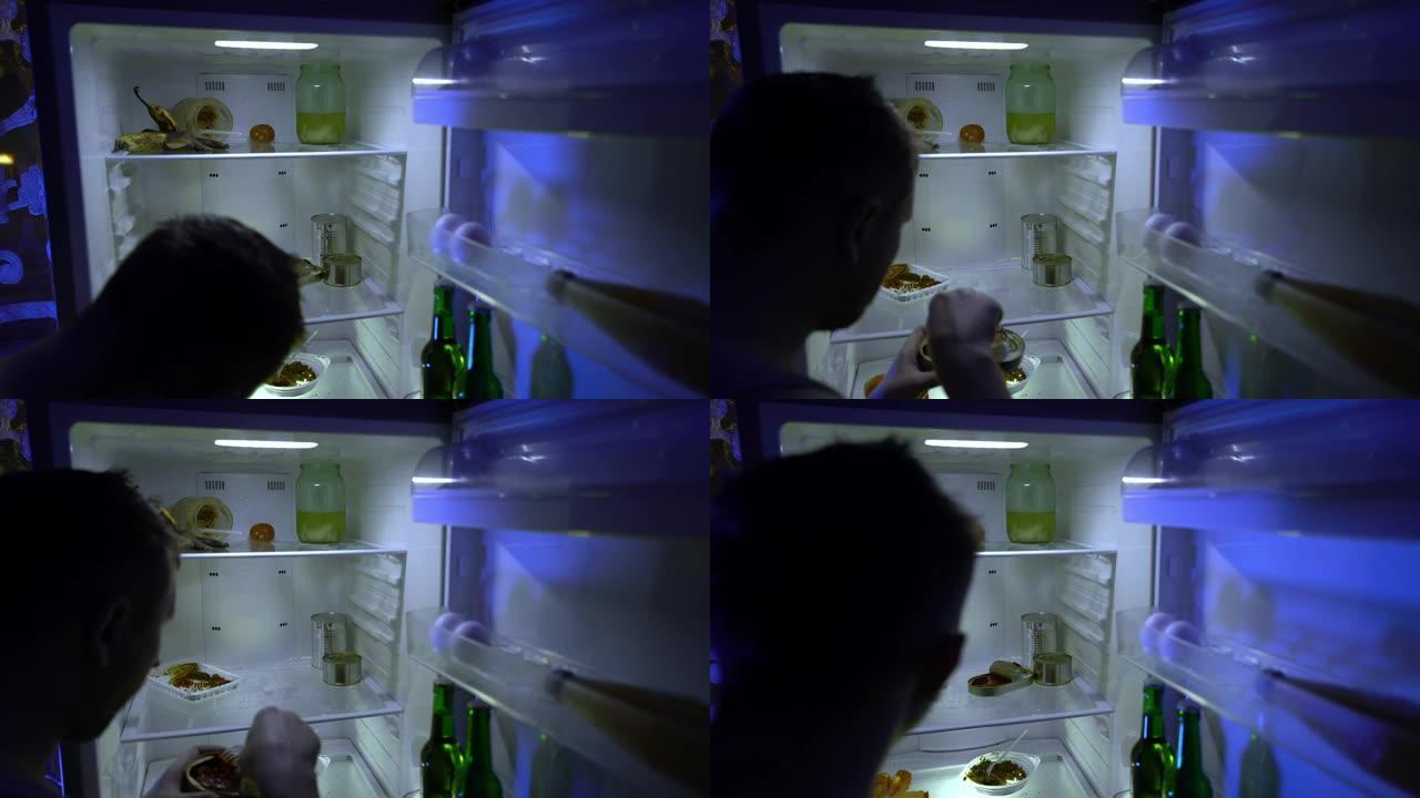 在冰箱里找食物的人。未刮胡子的人在冰箱里挖东西，尝试剩菜并关闭。