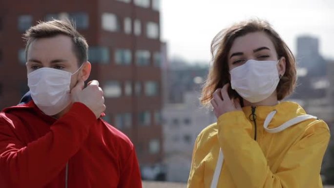 病毒流行病新型冠状病毒肺炎在一个城市结束，女人和男人脱下手术口罩