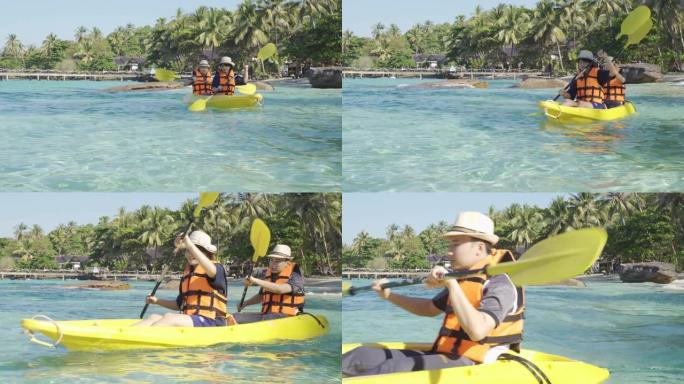 快乐的亚洲夫妇在泰国特拉特Koh Kood岛的蓝色泻湖海洋中玩皮划艇。水上旅游探险旅游目的地亚洲，暑